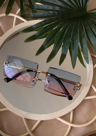 Rimless rectangle edge blue and pink blended sunglasses.