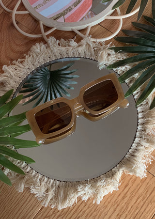Sand colored oversized rectangle sunglasses.