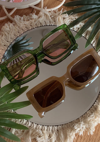 Sand colored oversized rectangle sunglasses.